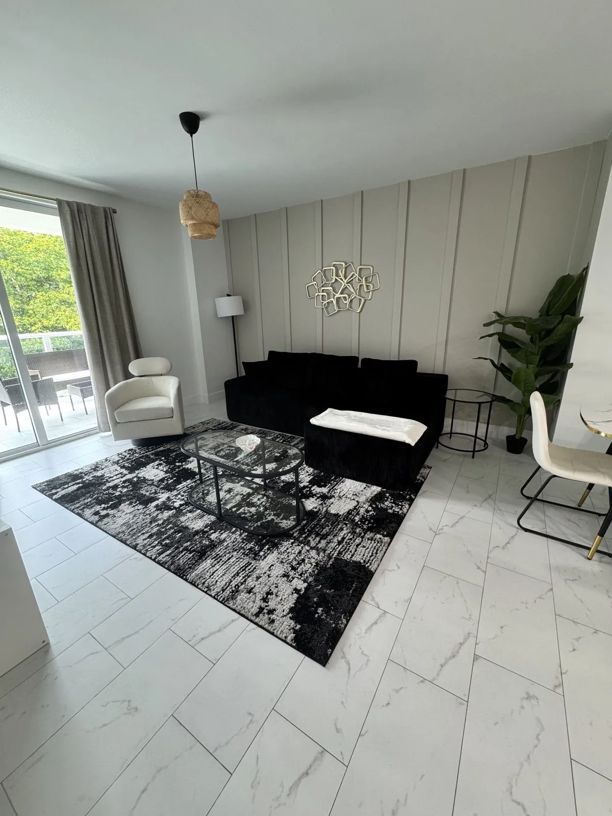 Clean living room with white marble floor in Broward County, FL
